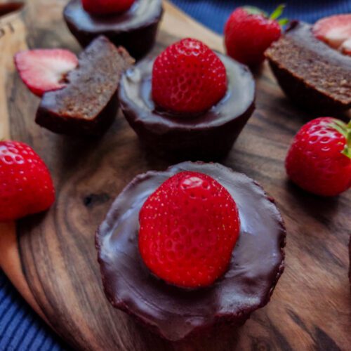 Raw Chocolate Hazelnuts and Strawberry Muffins on a cutting board