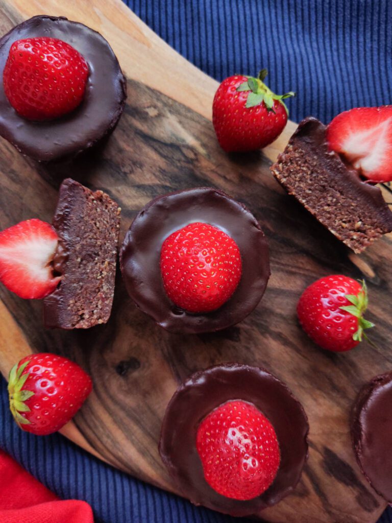 Raw Chocolate Hazelnuts and Strawberry Muffins on a cutting board