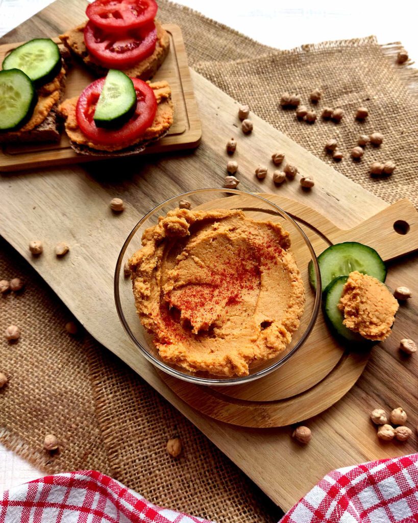 Hummus with Sun-Dried Tomatoes in a bowl and on a bread