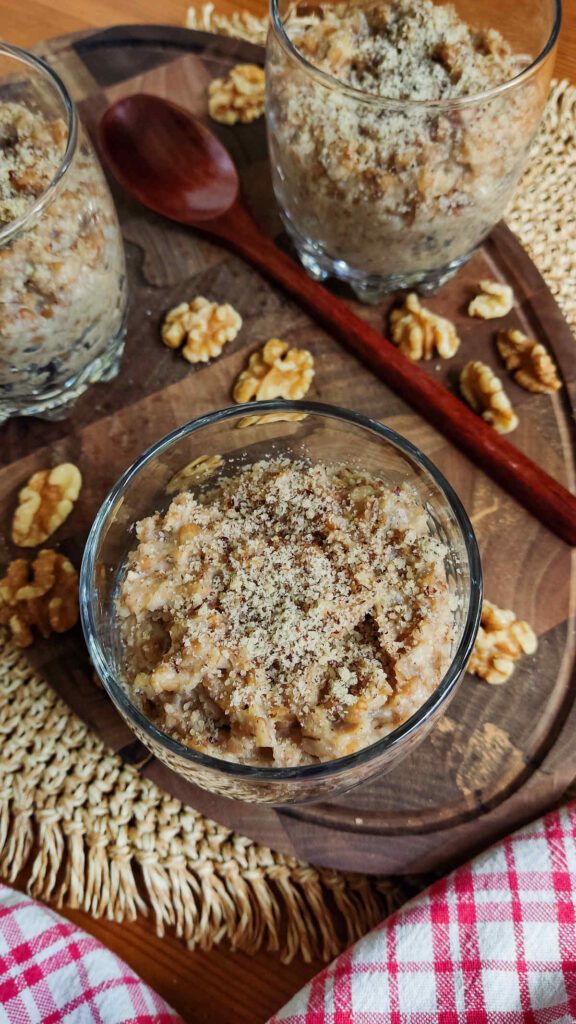 Spelt Porridge with Walnuts and Dates served in glass