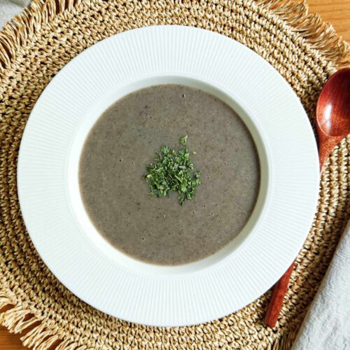 Creamy Mushroom Soup in a plate set on a table
