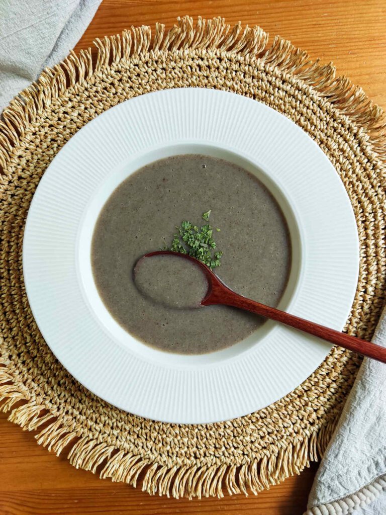 Creamy Mushroom Soup in a plate with a spoon